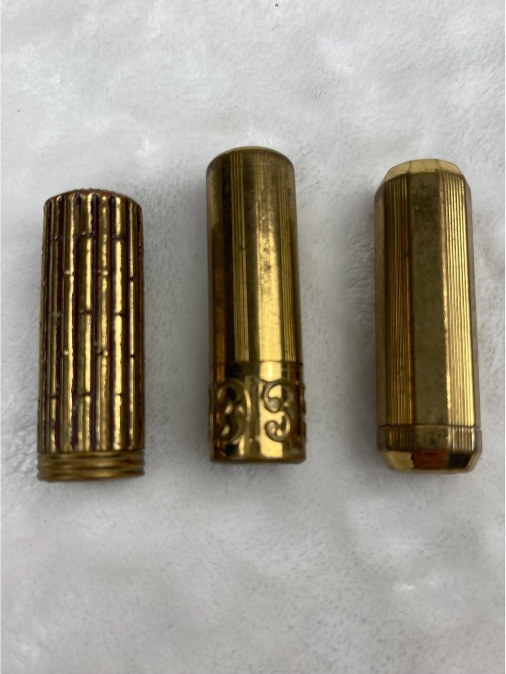 Mid-century vintage three tubes Avon lipsticks various shades, gold metal tubes